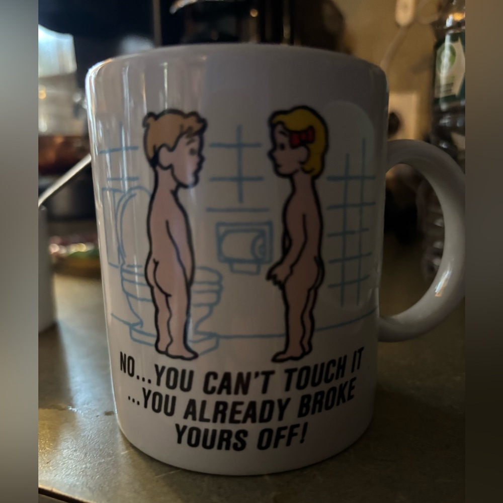 Playful White Coffee Mug with Cartoon Design